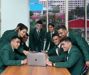 IIEBM students working together in the campus boardroom