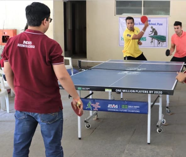 A table tennis match in the campus recreation area