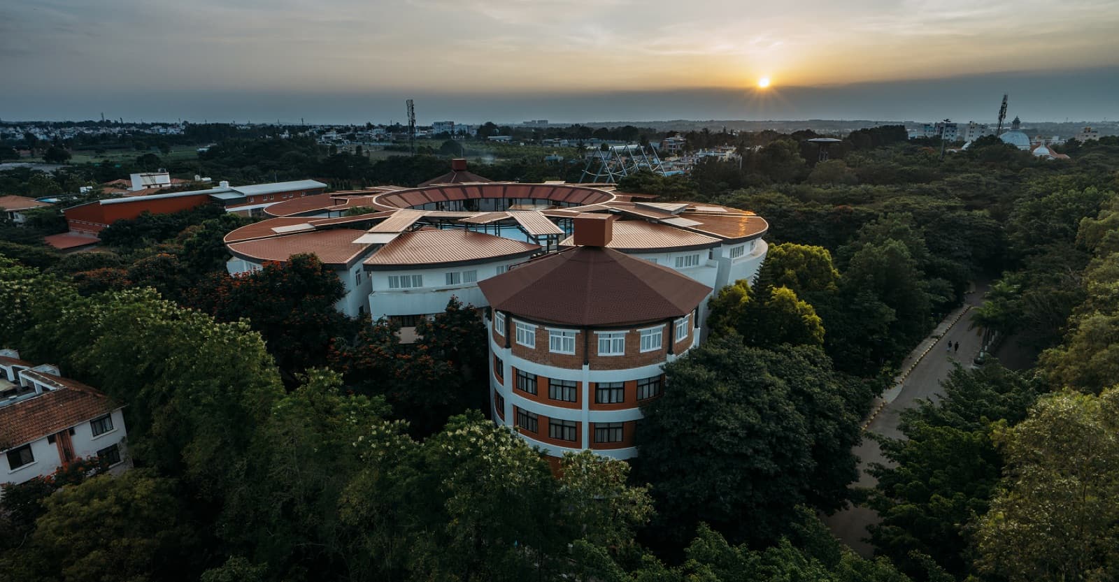 Aerial view of the Alliance University campus at sunset